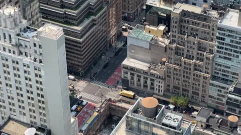 Busy Midtown Intersection with Yellow School Bus from High Angle 스톡 동영상 346557052