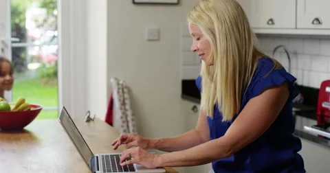 Busy mom multitasking while working from home Stock Footage 51902439