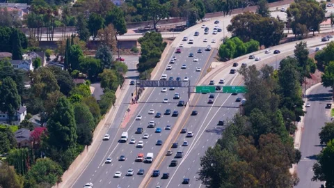 Busy multi-lane freeway with Pasadena and Los Angeles signs in California. Stock Footage 346785893