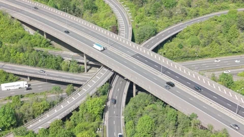 Busy Multi-Level Highway Interchange With Vehicles Driving Stock Footage 336953651