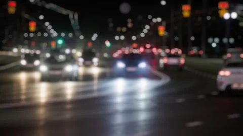 Busy Night Intersection with Blurred Vehicle Lights Stock Footage 335687972