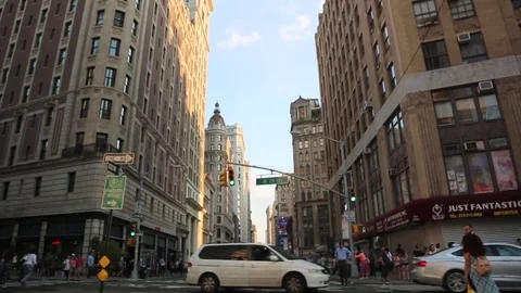 Busy NYC intersection with people walking by Stock Footage 78077264