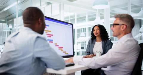 Busy Office Manager Organizing Workflow With Gantt Software And Calendar Stock Photos