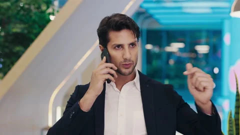 Busy Office Worker Solving Serious Business on the Phone and Gesturing. Stock Footage 304160214