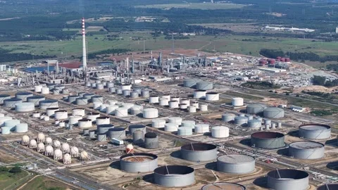 Busy oil refinery operations on a clear day in an industrial area Stock Footage 334641671