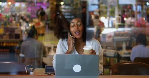 Busy overworked multi-ethnic young woman, freelancer in casual wear, talking on Stock Footage 231022693