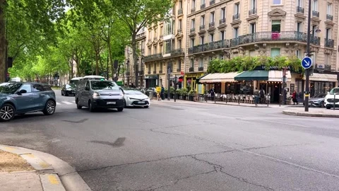 Busy Parisian streets, intersection, pedestrian crossing, people and cars. Stock Footage 312601895
