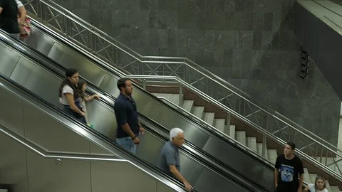 Busy passengers going on a metro elevator in Athens metro system in the summer Stock Footage 118596051