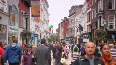 Busy people are hurrying on business in a Grafton Street in Dublin, Ireland. Stock Footage