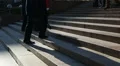 Busy people climbing up and down the stairs, crowd near architectural building HD Footage