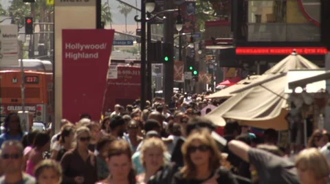 Busy people at intersection crowd hollywood blvd and highland crosswalk Stock Footage 54294555