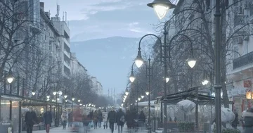 Busy people on Sofia Boulevard with a snowy mountain background Video stock 86053455