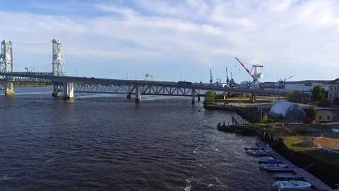Busy River Bridge and Shipyard Stock Footage 97243748