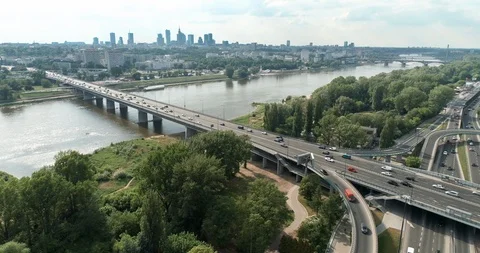 Busy road intersection during sunny day aerial footage Stock Footage 100342817