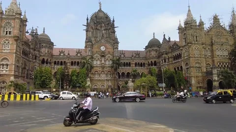 Busy road intersection in front of CST train station in Mumbai. Stock Footage 194418182