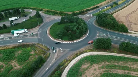 Busy roundabout in the evening sun, drone 4k  hyper lapse. Stock Footage 246504872