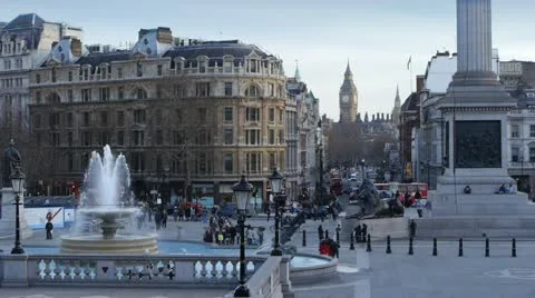 Busy scene in Trafalgar Square, London. Big Ben in the background. Stock Footage