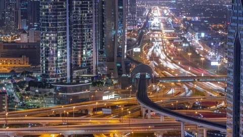 Busy Sheikh Zayed Road intersection aerial night timelapse, metro railway and Video stock 200976433