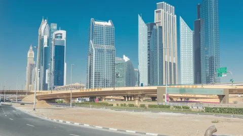 Busy Sheikh Zayed Road timelapse, metro railway and modern skyscrapers around in Stock Footage 171998719