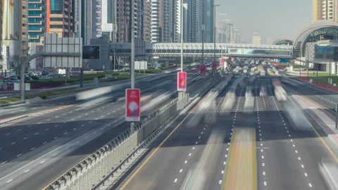 Busy Sheikh Zayed Road timelapse, metro railway and modern skyscrapers around in Video stock 171998792