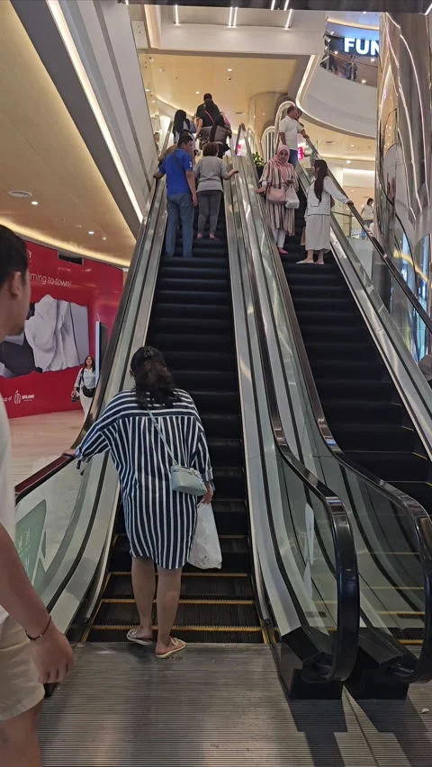 Busy Shopping Mall Escalators with Crowd of Shoppers Ascending Stock Footage 293227397