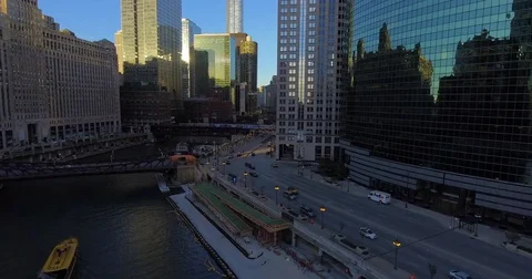 Busy street and river amidst city buildings Stock Footage 81529853