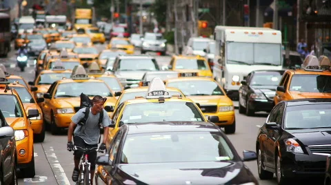 Busy street with cabs and pedestrians Stock Footage