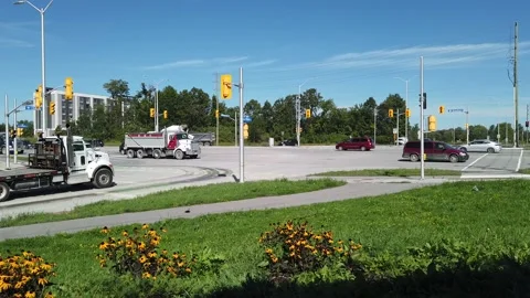 Busy street corner traffic dump truck cement mixer Stock Footage 138744971
