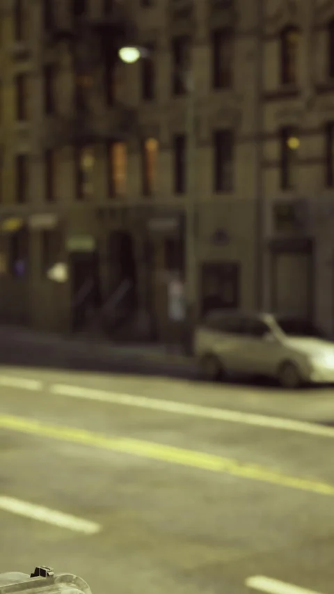Busy street intersection with traffic lights and yellow taxi in urban area Stock Footage 325074532