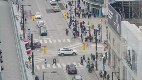Busy street intersection at Yonge and Dundas, Toronto, Canada Stock Footage 306556552