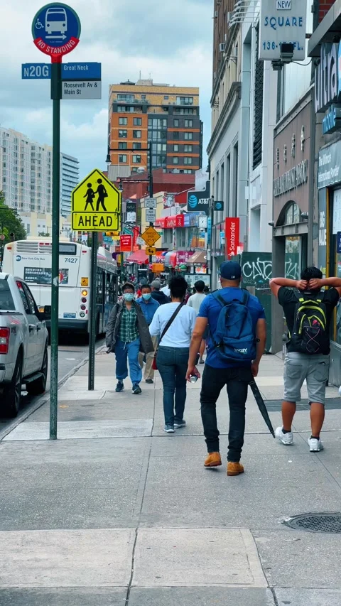 Busy street scene in Flushing Queens with pedestrians Stock Footage 331600427