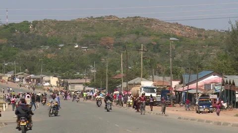 Busy street in small african town Stock Footage