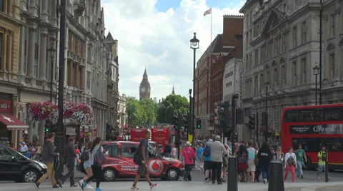 Busy street traffic car red bus double-decker black taxi London UK Great Britain Stock Footage