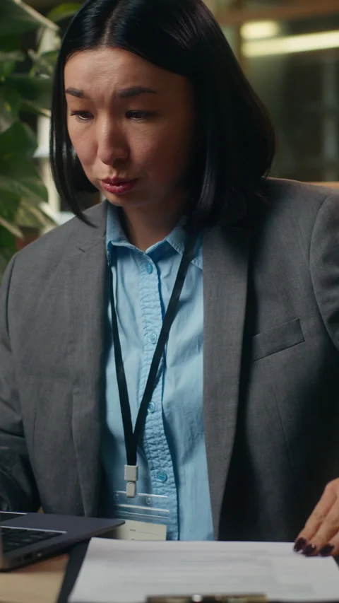 Busy stressed multitasking Asian Korean business woman working laptop Stock Footage 317347781