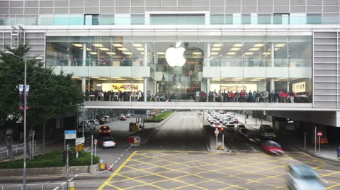 Busy traffic and apple store building in modern city, time lapse. Stock Footage 48436801