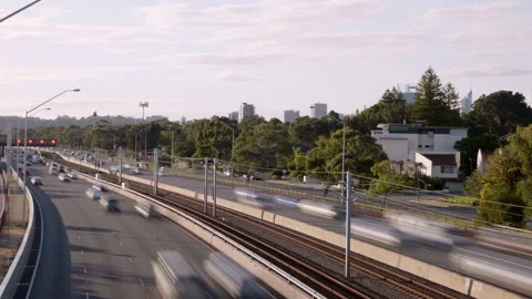 Busy traffic and train rush along Perth freeway. Overhead view Video stock 159129388