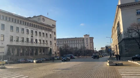 Busy Traffic And Yellow Bricks Outside Bulgarian National Bank Sofia 스톡 동영상 324164636