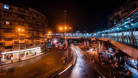 Busy traffic below elevated Skywalk time lapse at night Stock Footage 119138245