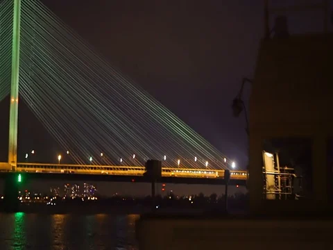 Busy traffic on the bridge at night,  view from deck of an old boat Stock Footage 71861735