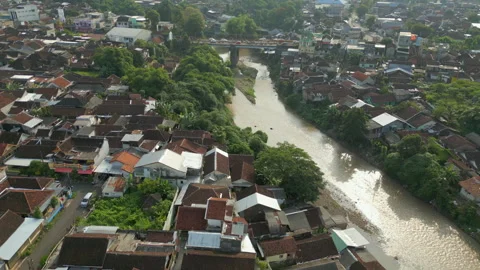 Busy Traffic Crosses Bridge In Crowded Jember City East Java Indonesia Drone 스톡 동영상 345015476