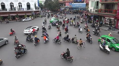 Busy traffic intersection in downtown old Hanoi city, urban Vietnam Stock Footage 60692545