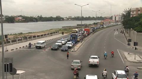 Busy traffic junction by river Stock Footage 38386570