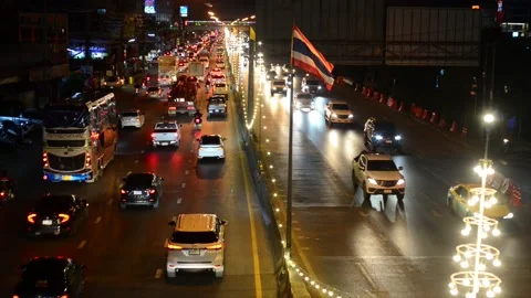 Busy traffic in pathum thani district of Bangkok at night Thailand Stock Footage 229259952