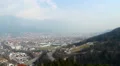 Busy traffic on roads of Austrian city at mountain bottom HD Footage