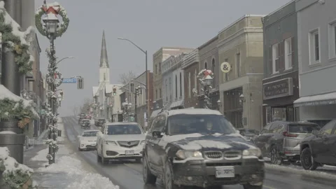Busy traffic on small town Main Street Video stock 310685231