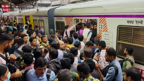 Busy train station. Platform and stairs packed with people. 4K Stock Footage 247891865