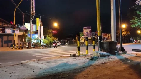 Busy transportation at traffic light intersection at night Stock Footage 207294256