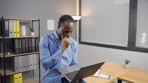 Busy, typing and a black man with a laptop at work for communication Stock Footage 276835727