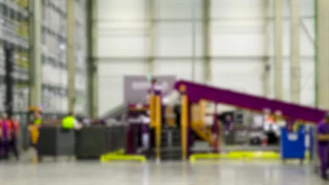 Busy warehouse interior with conveyor belts. Blurred industrial background.. Video stock 341790152
