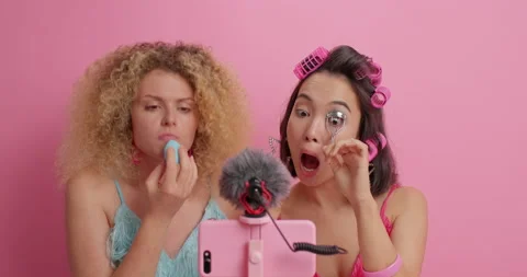 Busy women do make up apply foundation on face use eyelashes curler try new Stock Footage 156228474